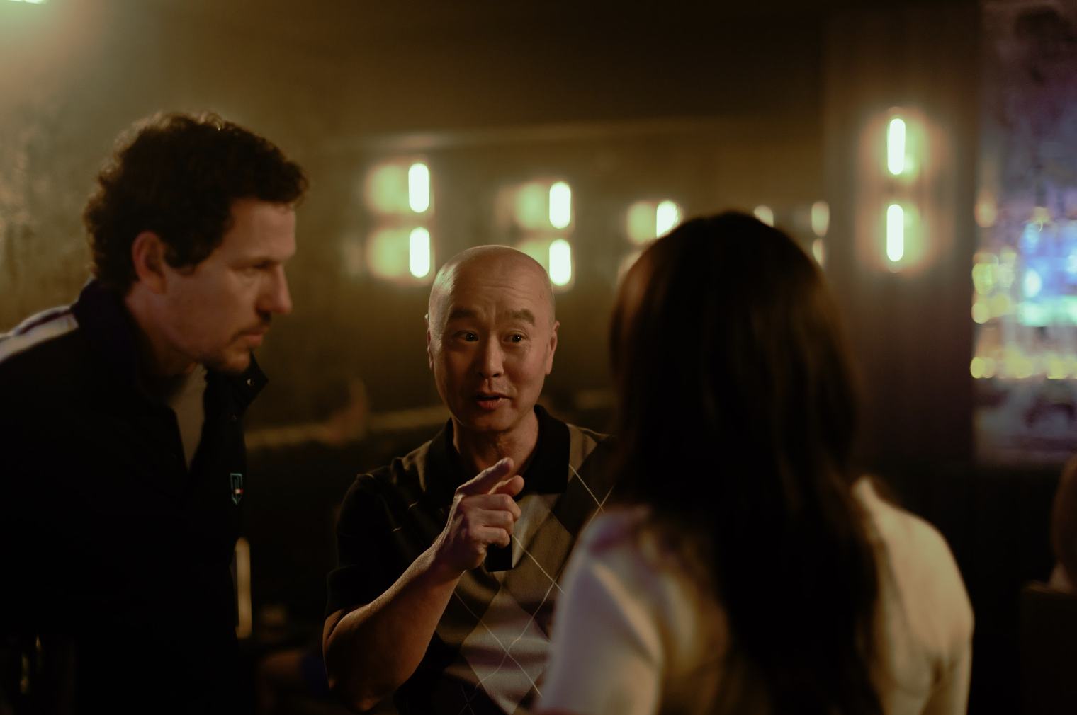 C.S. Lee in a scene at a bar